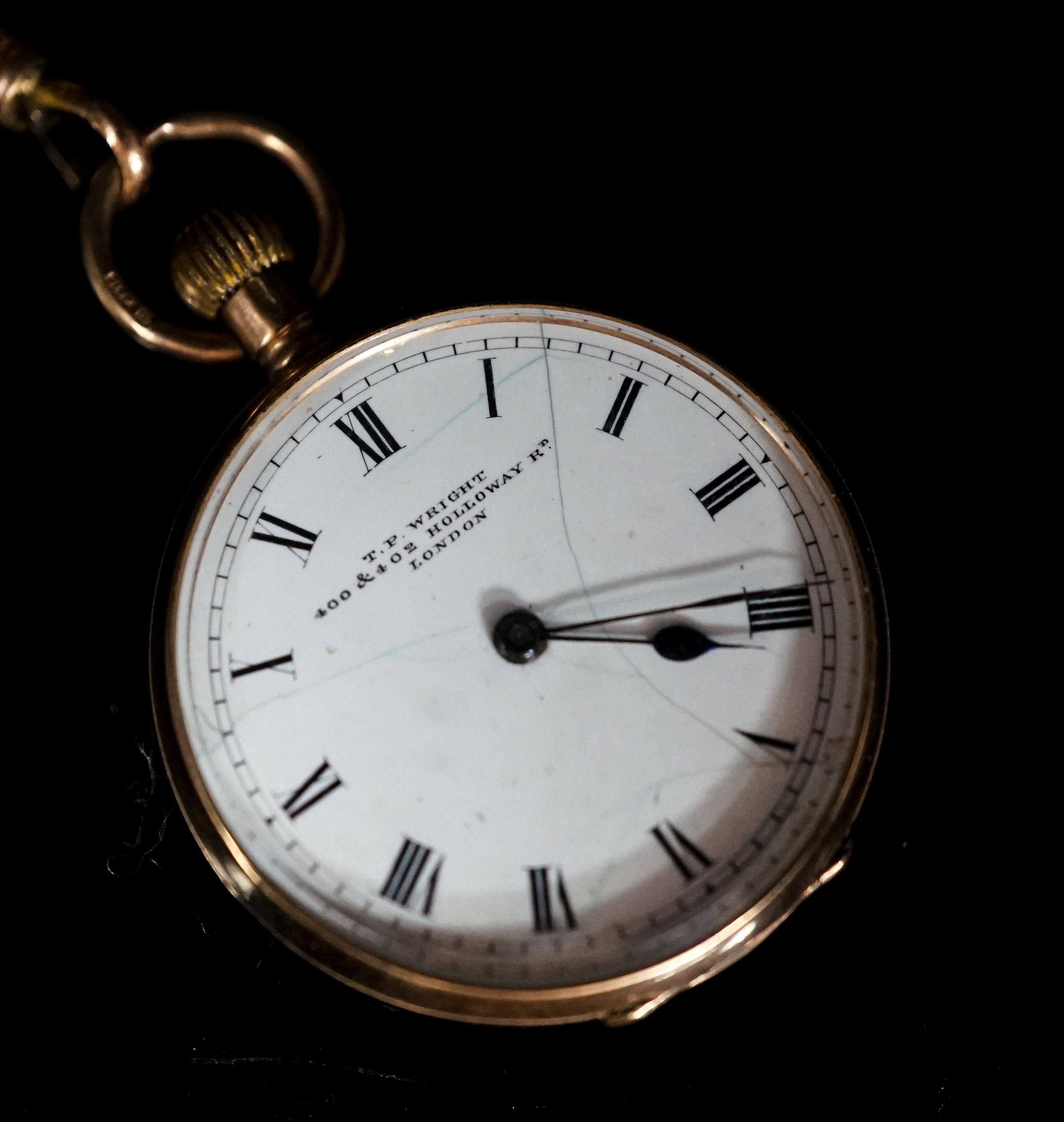 An early 20th century 9ct gold open faced fob watch, case diameter 30mm, on a 9ct suspension brooch, gross weight 26.4 grams.